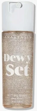 Bottle of Anastasia Beverly Hills Dewy Set Setting Spray with shimmering gold detail.