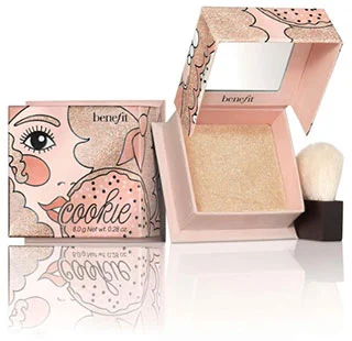 Benefit Cookie highlighter powder with brush, featuring open packaging and shimmering product inside.