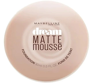 A round container of Maybelline New York Dream Matte Mousse Foundation in Classic Ivory showcasing a smooth and creamy texture with a matte finish.