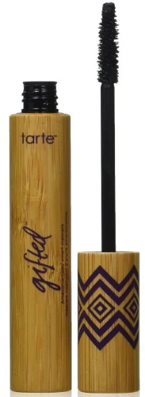 A tube of Tarte Cosmetics Gifted Amazonian Clay Smart Mascara, featuring a bamboo design and a black mascara wand, displayed with the cap off, showcasing its unique packaging.