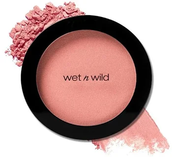 Wet n Wild Color Icon Blush in a pink shade with powder scattered around the container.